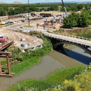 A bridge leading to the construction site with three pairs of abutments.